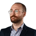 beard man use glass with suit face to the left